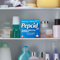 Pepcid AC Original Strength at a desk, ready for quick heartburn prevention.