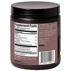 Scoop of chocolate ketones powder with a glass of water