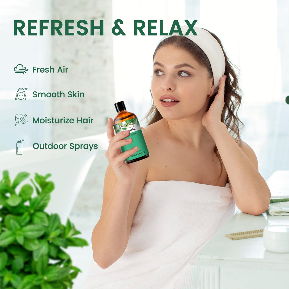 Close-up of PHATOIL Peppermint Essential Oil amber bottle
