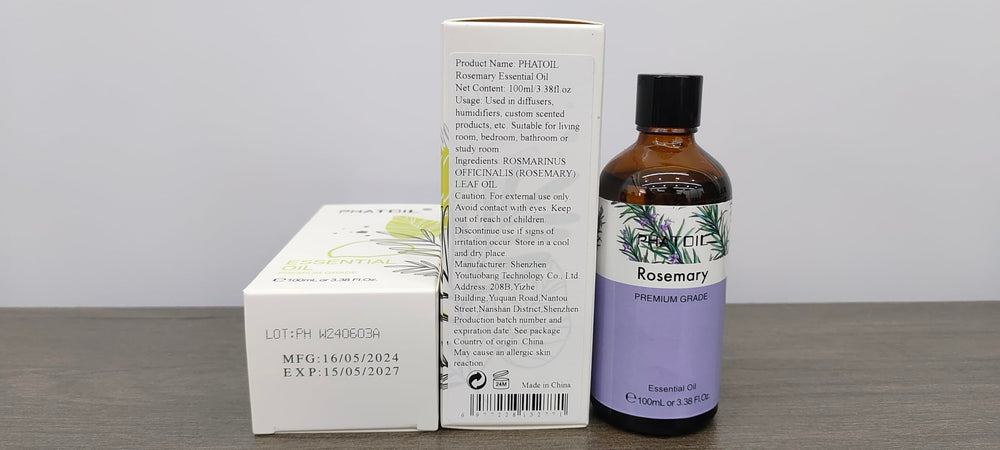 Close-up of PHATOIL rosemary essential oil packaging and label