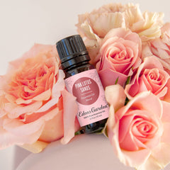 Close-up of Pink Lotus Sands essential oil bottle and label
