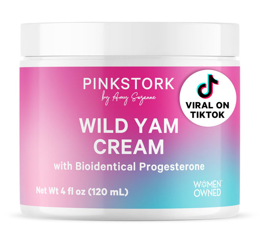 Pink Stork Wild Yam Cream tube on a clean counter for on-the-go hormone support.