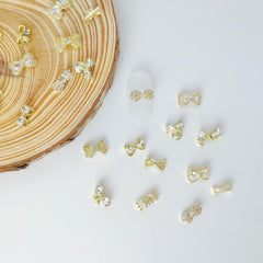 Pizadix bow nail art accessory collection offers versatile layering for dramatic looks.