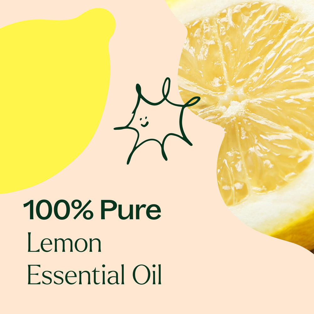 Close-up of clear lemon essential oil in glass bottle