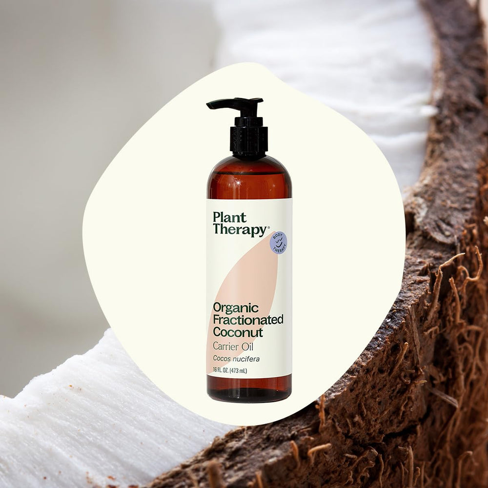 Pouring colorless fractionated coconut oil onto skin