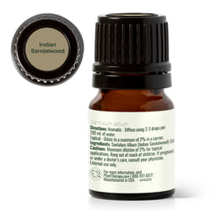 Plant Therapy Sandalwood Indian Oil being poured for a soft ambient aroma.
