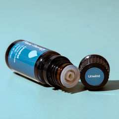 Unwind essential oil blended with a carrier oil for massage