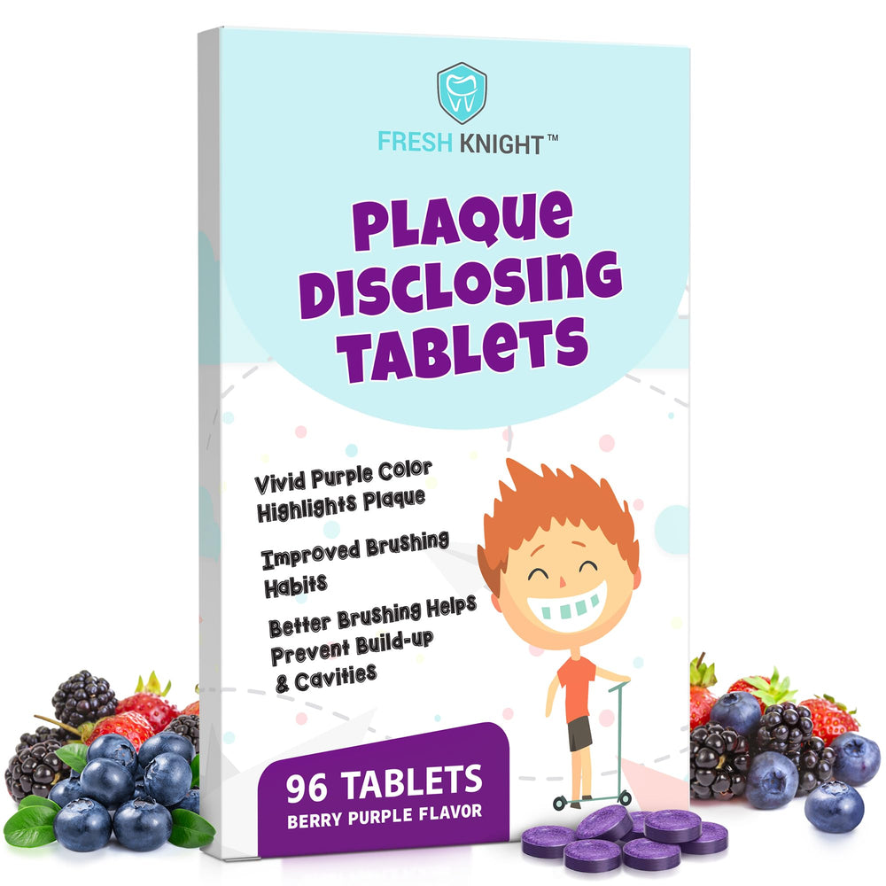 Plaque disclosing tablets on teeth showing plaque areas in purple.