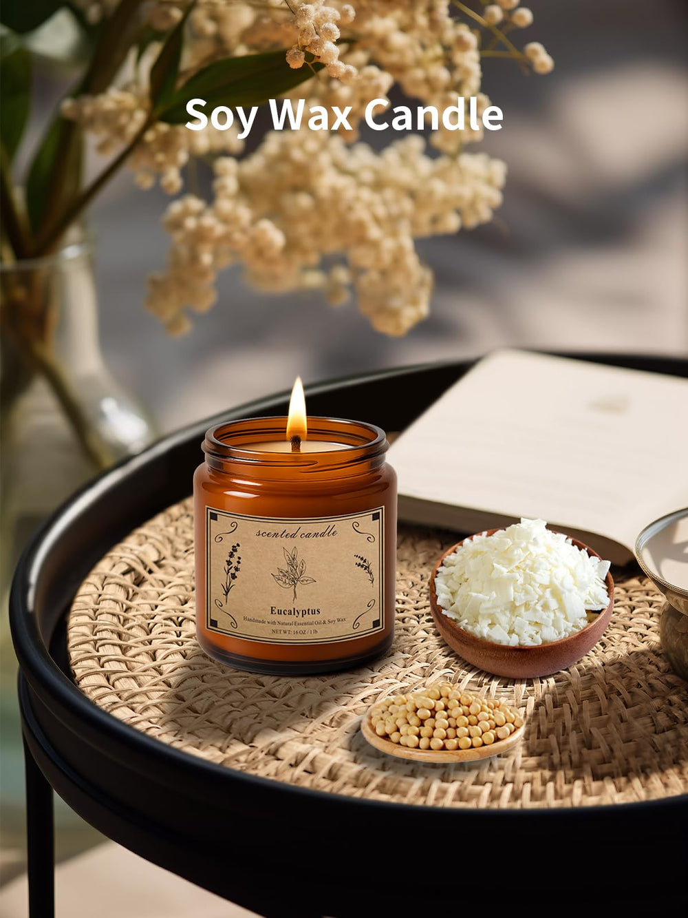 POOTES amber glass jar with gold lid candle on a wooden surface