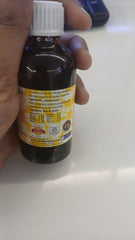 Pure Guaiacwood essential oil in amber bottle close-up