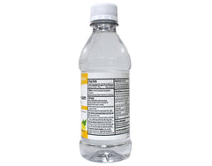 Magnesium citrate oral solution bottle held for scale, 10 fl oz