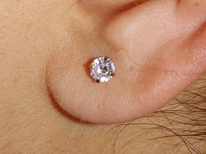 QWALIT clear ear studs provide versatile, discreet options.