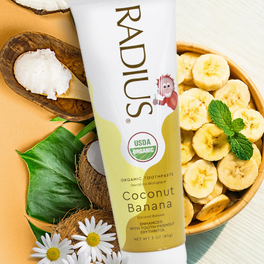 Child brushing teeth with Radius Organic Toothpaste Coconut Banana