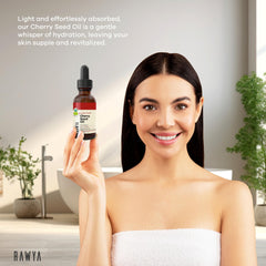 RAWYA Cherry Oil being applied to skin