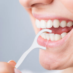 Two packs of 250 disposable dental flossers shown