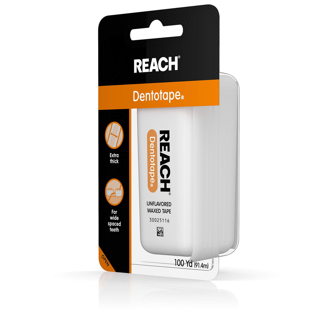 Dental hygiene setup with Reach Dentotape on a clean surface