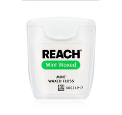 Floss being prepared for use with mint flavor