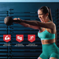 Scoop containing creatine monohydrate powder