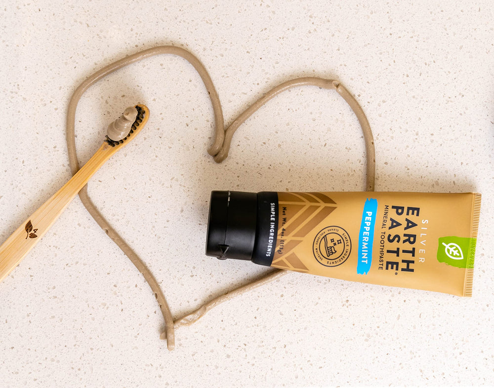 Close-up of natural ingredients: bentonite clay, sea salt, essential oils