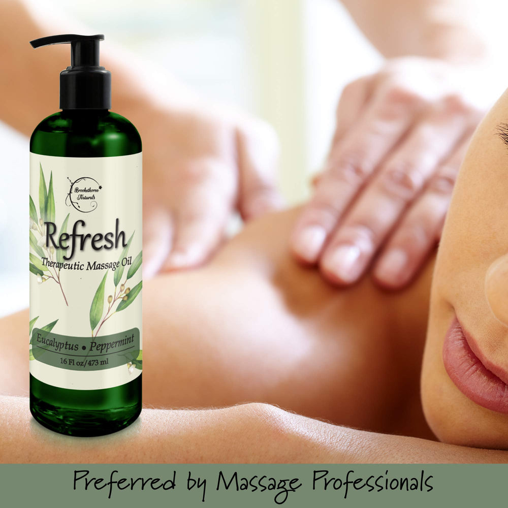 Therapist applying Refresh Massage Oil for smooth glide during therapy