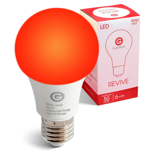 Revive 670nm red light bulb glowing softly in a lamp for sleep therapy
