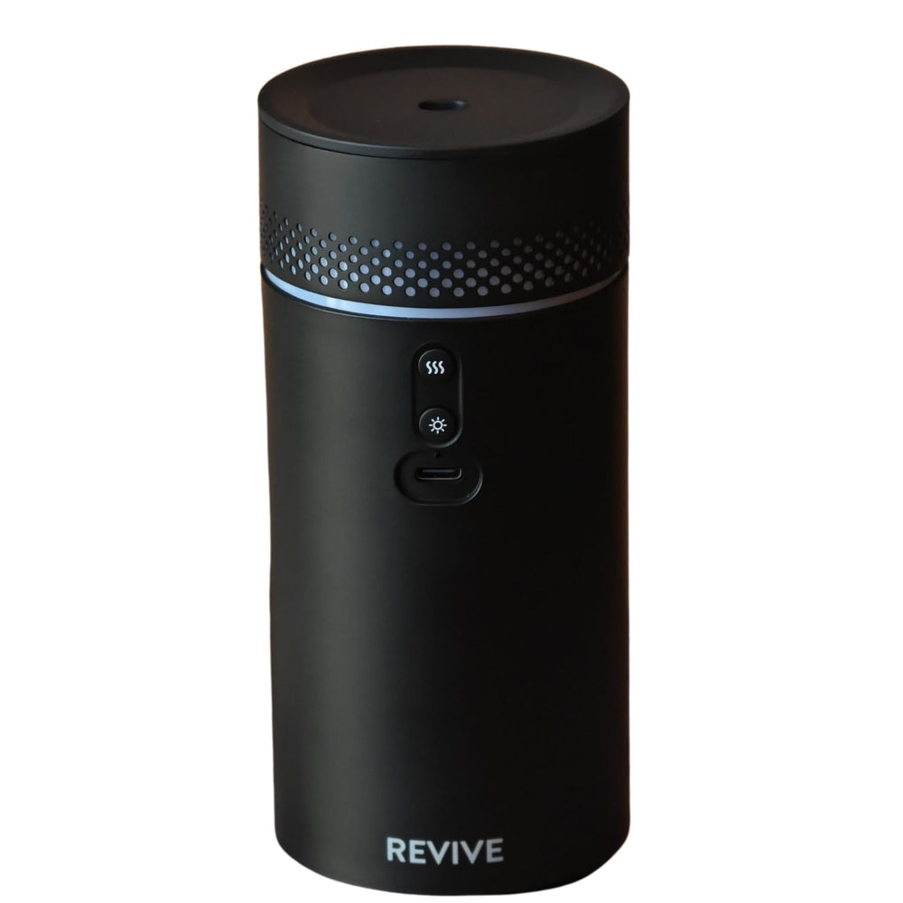 Revive Essential Oils Forte Rechargeable Diffuser in car cup holder provides drive-time aroma.
