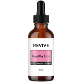 Bottle of REVIVE Healthy Hair Essential Oil Blend