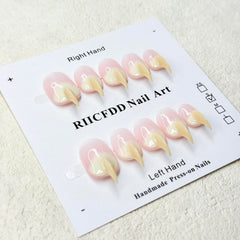 RIICFDD beige curved stiletto cat-claw nails on tray for durable wear.
