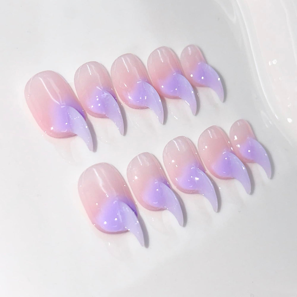 RIICFDD curved press-on nails in stiletto cat-claw shape for a salon-grade manicure.