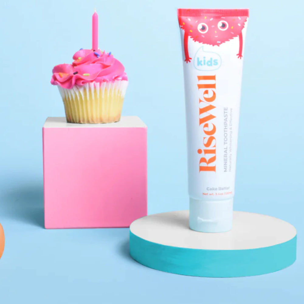 Child brushing teeth with Risewell Kids Cake Batter toothpaste