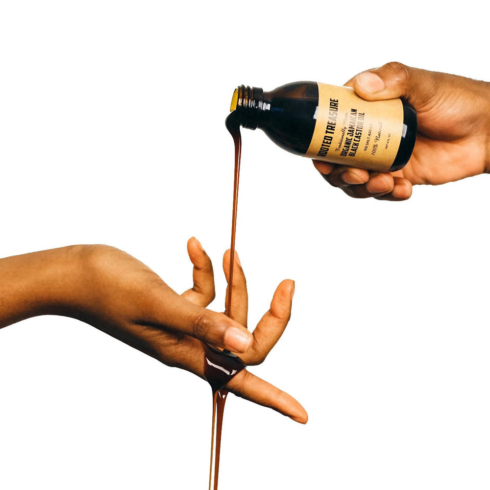 Close-up of Rooted Treasure Jamaican Black Castor Oil bottle