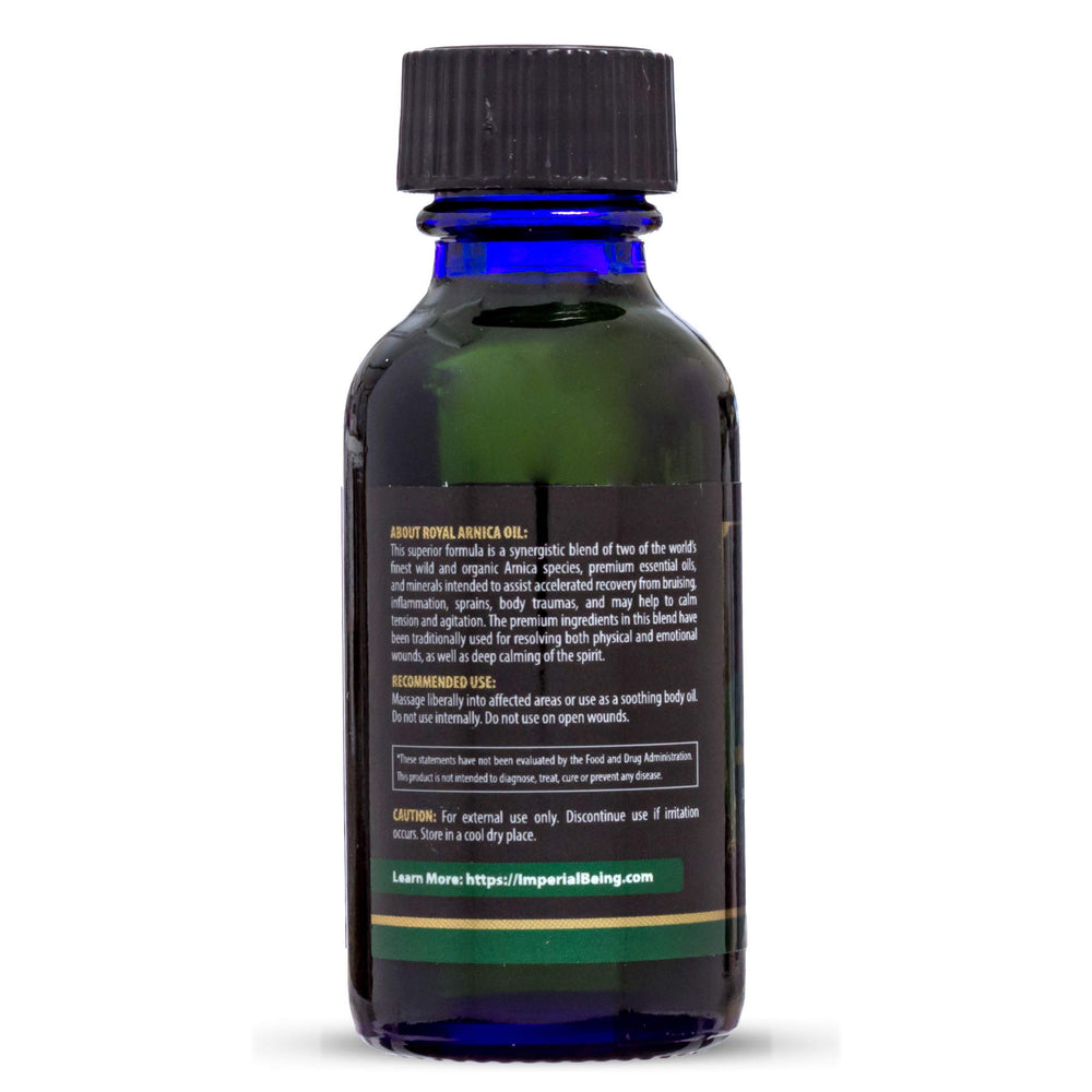 Hands applying Royal Arnica Oil during massage