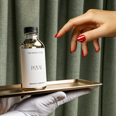 Diffuser bottle beside a diffuser device to show usage