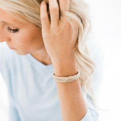 Neutral Cutie Bands used in hair for a secure hold with no damage.