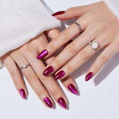 S.T. Friends almond nails in red cat eye design for effortless DIY glam