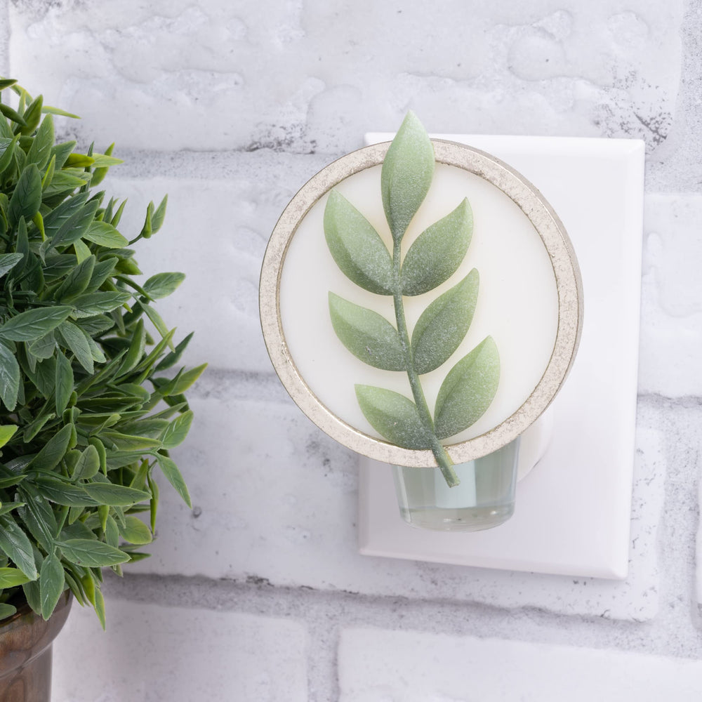 Close-up of Scent Charm diffuser with ambient light