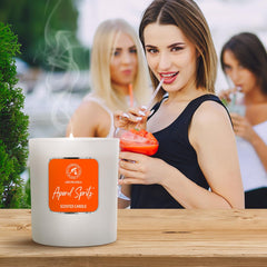Dim light with Aperol Spritz candle glow