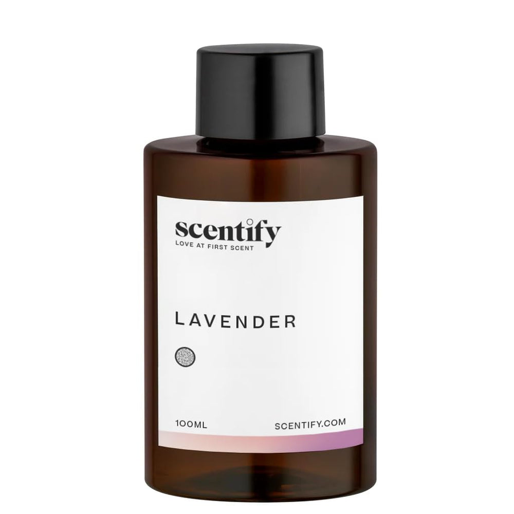 Close-up of amber diffuser oil bottle with lavender musk label