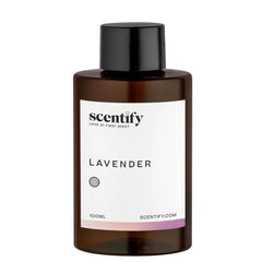 Close-up of amber diffuser oil bottle with lavender musk label