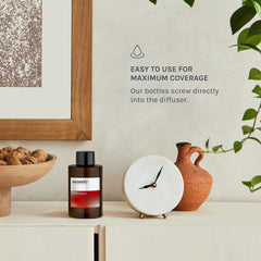 Scentify amber bottle styled as a holiday gift for luxurious presentation