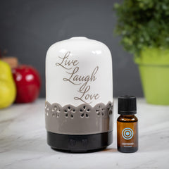 ScentSationals Sentiments diffuser soft-glow lights bedside, creating a calming bedroom atmosphere.