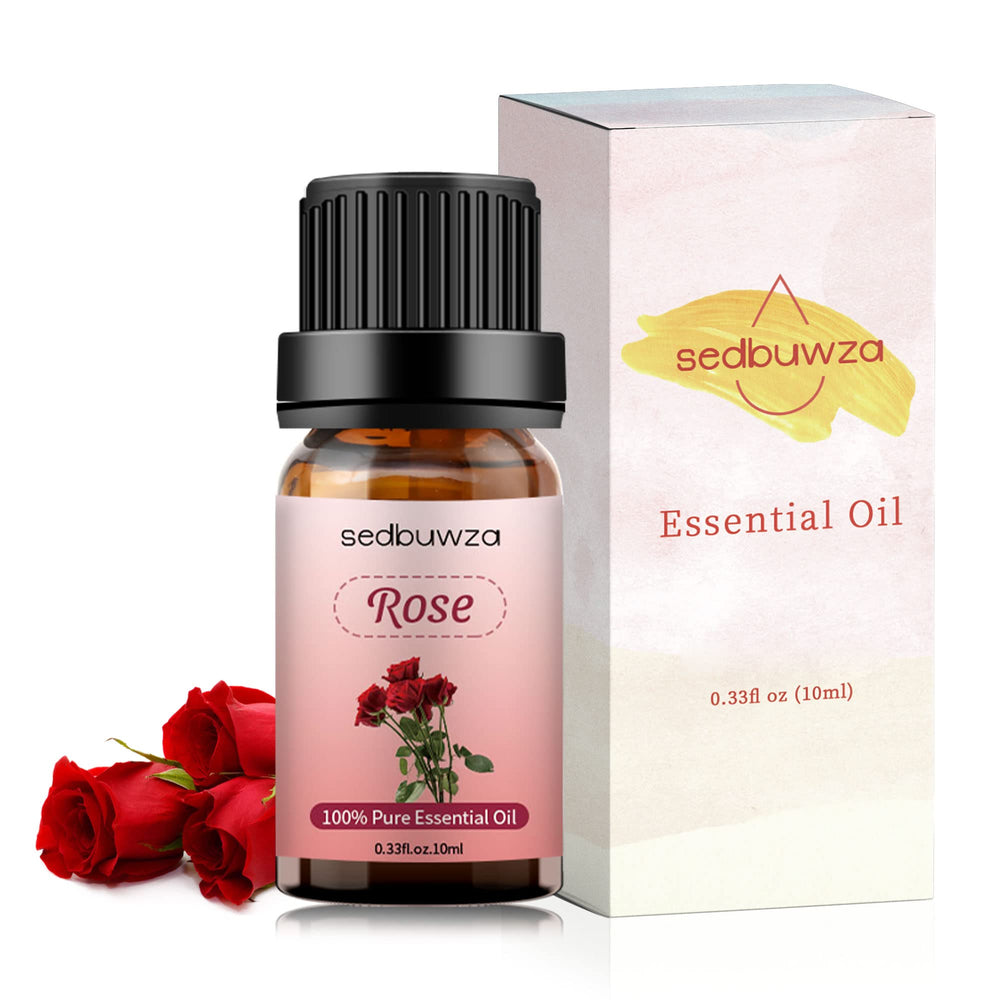 Rose essential oil bottle beside diffuser