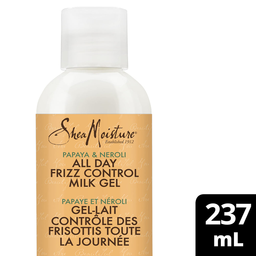 Applying SheaMoisture milk gel to damp hair for frizz control