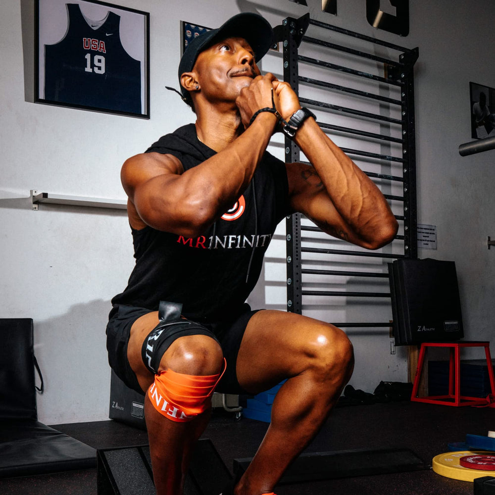 Person performing shoulder mobility exercise with Shogun Floss Bands