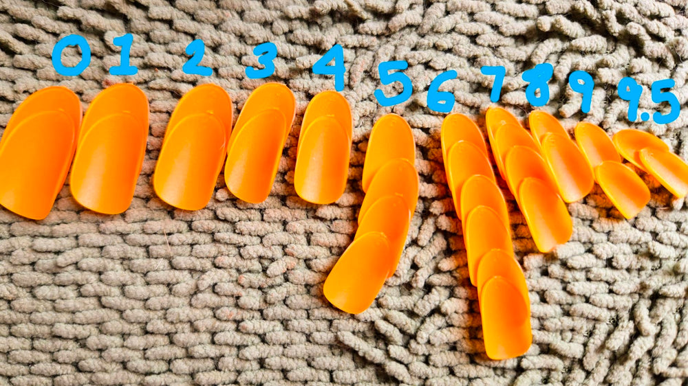 Shoindary orange press-on nails close-up showcasing glossy finish