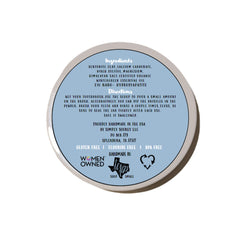 Close-up of Simply Sooney Remineralizing Tooth Powder with a wooden scoop