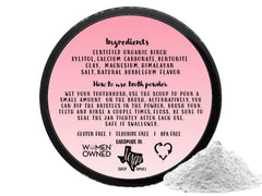 Close-up of the Simply Sooney tooth powder jar open with powder