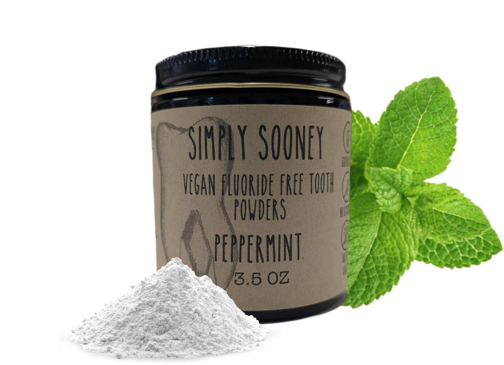 Front view of Simply Sooney remineralizing vegan fluoride-free tooth powder in a glass jar