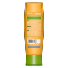 Applying SKALA Banana Conditioner to strands for smoother, manageable hair