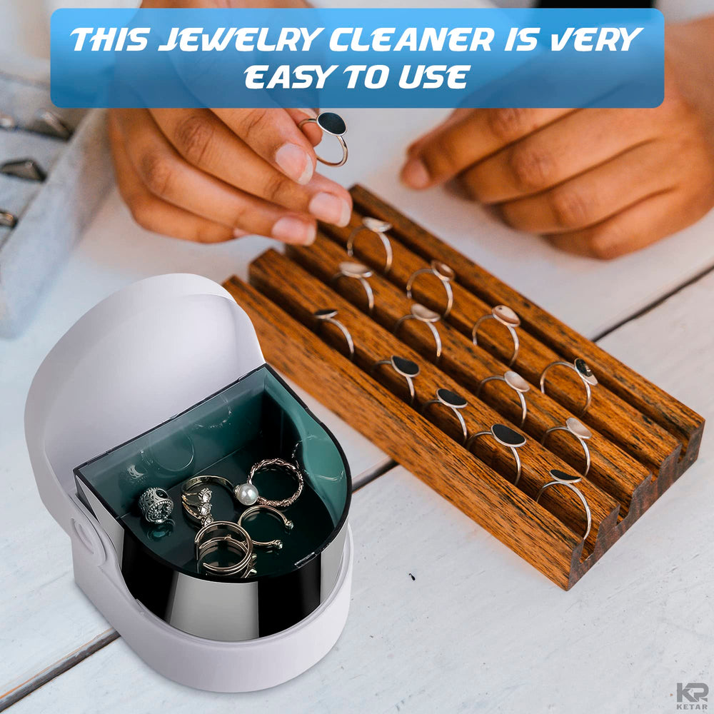 Coins being cleaned with the Sonic Cordless Denture Cleaner